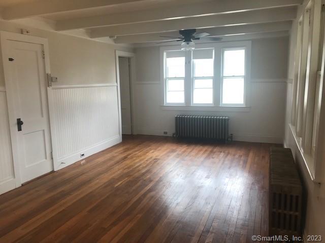 19 Greenfield Avenue Ridgefield, CT 06877 - Photo 4 of 28 an empty room with wooden floor and windows