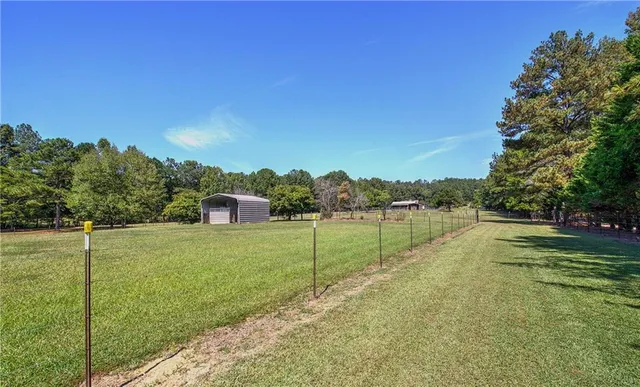 a view of a lake with a big yard