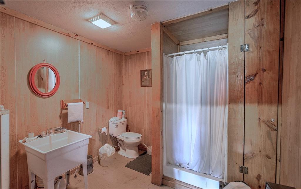 0 Little Texas Valley Road Northwest Rome, GA 30165 - Photo 18 of 22 a bathroom with a toilet a sink and a shower
