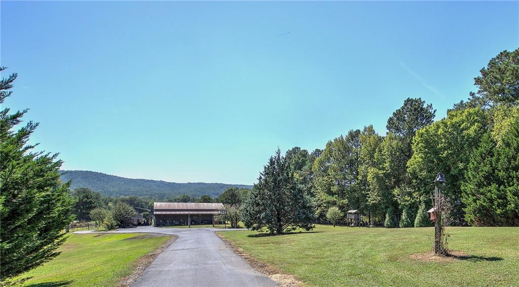 0 Little Texas Valley Road Northwest Rome, GA 30165 - Photo 7 of 22 a view of a garden with a building in the background