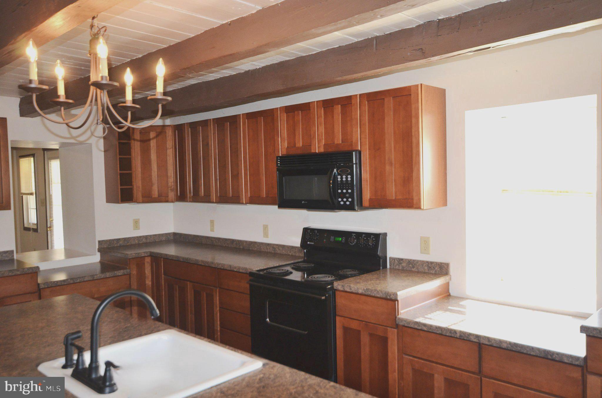 1059 Cashtown Road Biglerville, PA 17307 - Photo 25 of 32 Warm wood tones in a cozy kitchen.