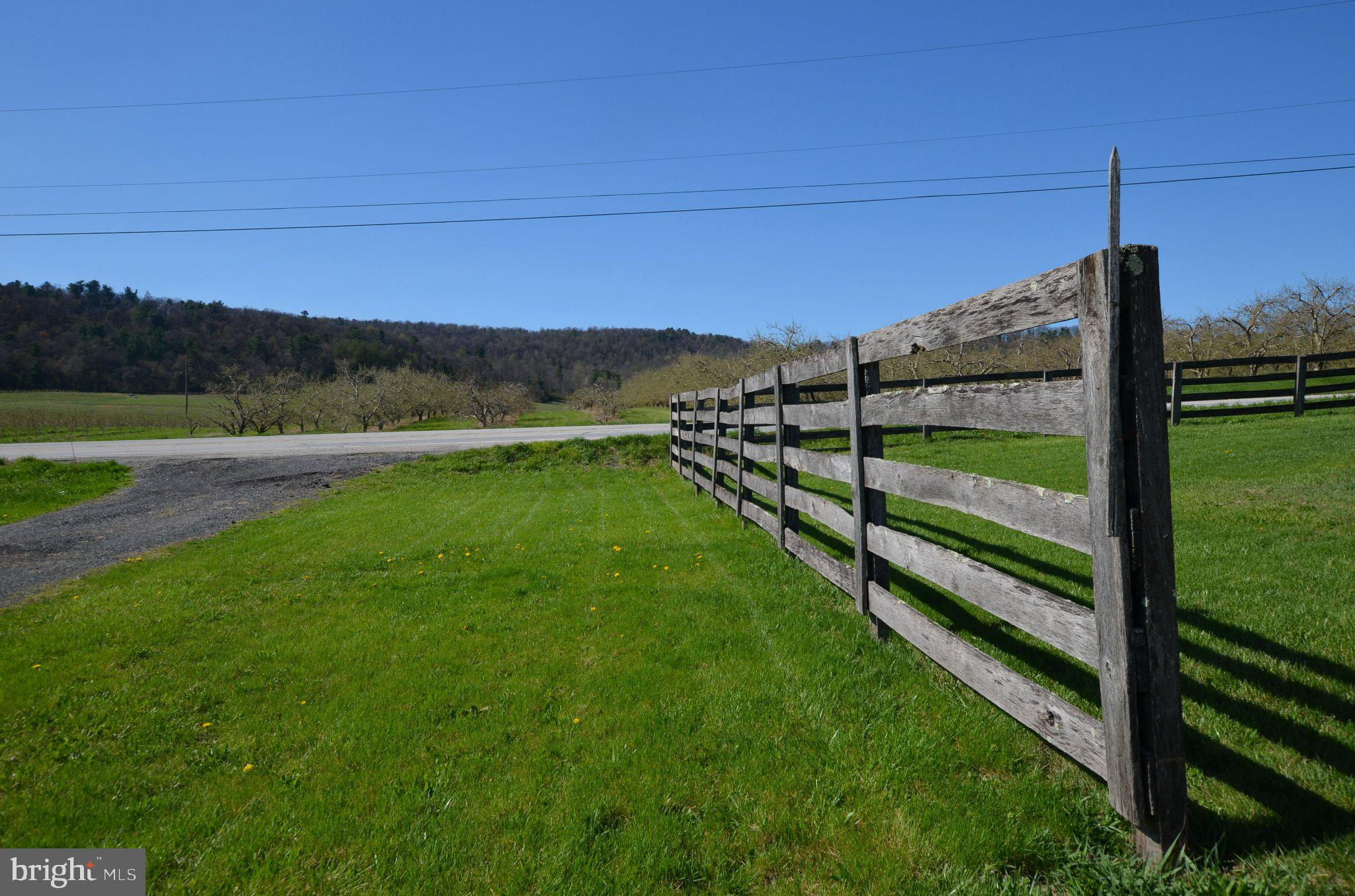 1059 Cashtown Road Biglerville, PA 17307 - Photo 4 of 32 Serene countryside with rustic fence.