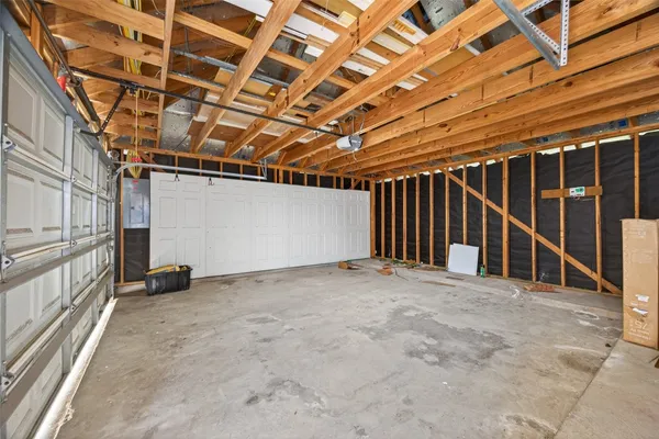 a view of an empty room with wooden walls
