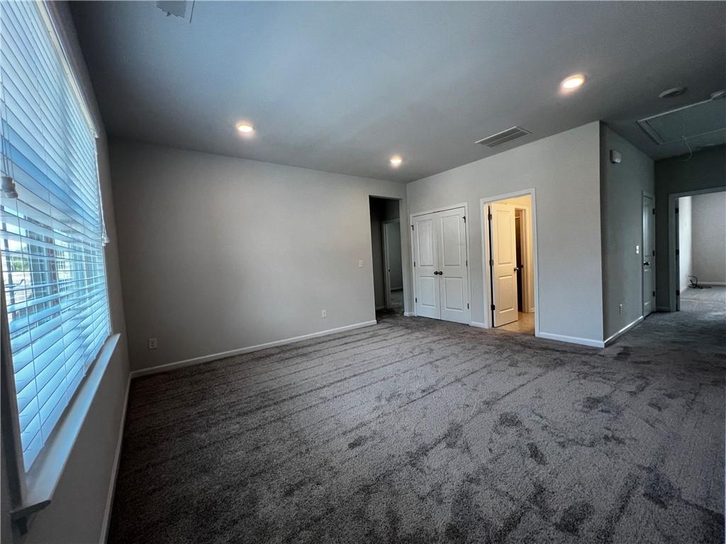 3339 Fall Branch Lane Buford, GA 30519 - Photo 11 of 30 an empty room with closet and windows
