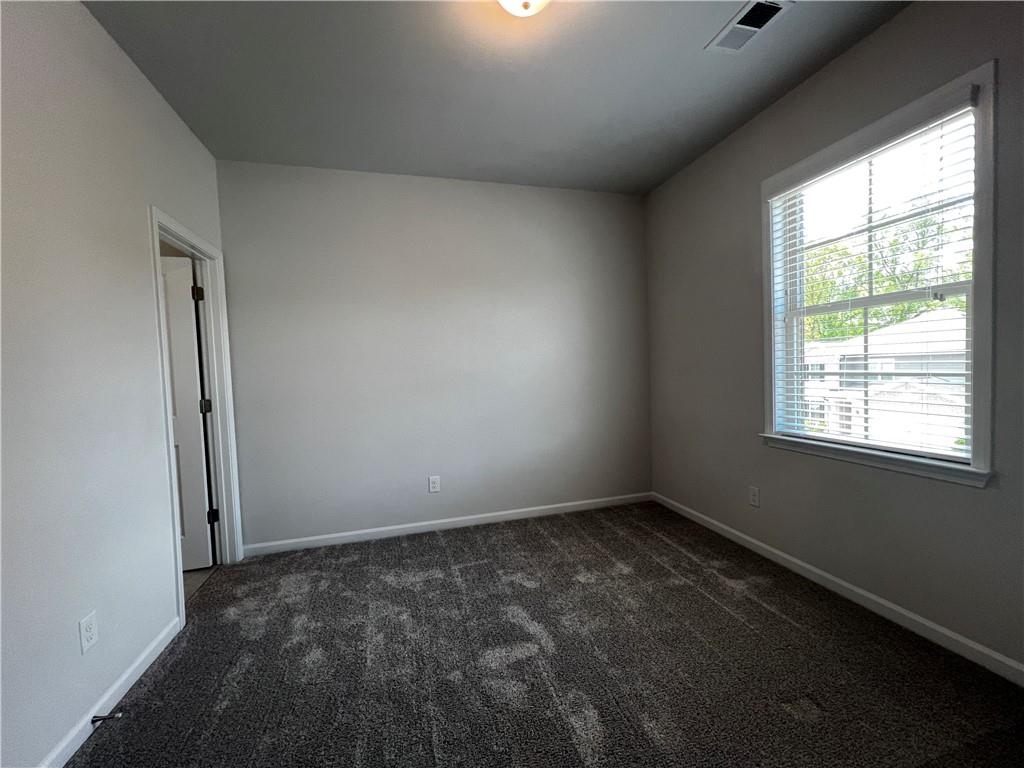 3339 Fall Branch Lane Buford, GA 30519 - Photo 12 of 30 an empty room with a empty space and a window
