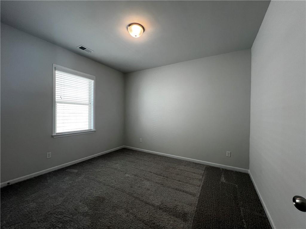 3339 Fall Branch Lane Buford, GA 30519 - Photo 13 of 30 an empty room with a empty space and windows