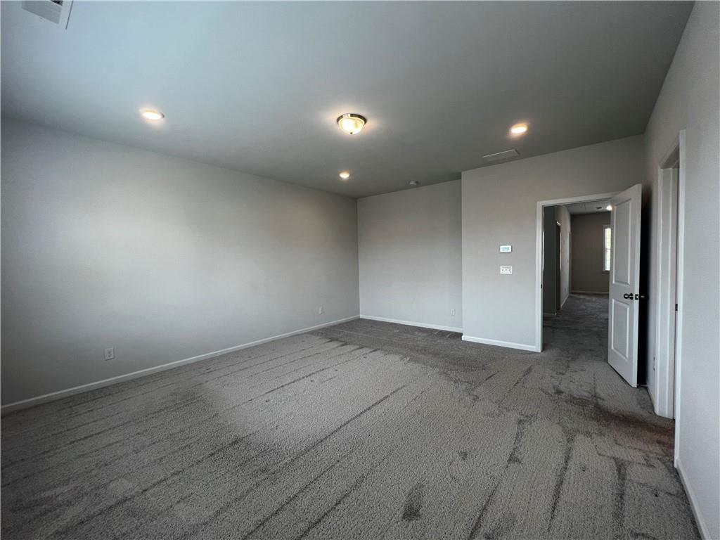 3339 Fall Branch Lane Buford, GA 30519 - Photo 18 of 30 an empty room with wooden floor and windows
