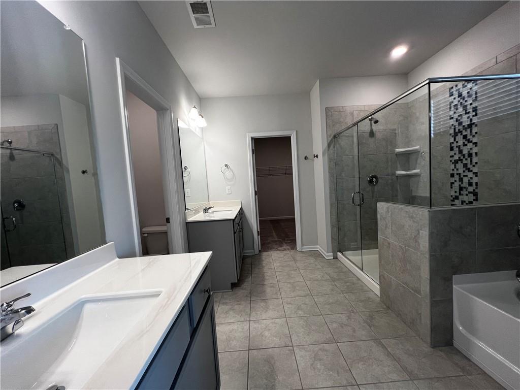 3339 Fall Branch Lane Buford, GA 30519 - Photo 21 of 30 a bathroom with a bathtub and a sink