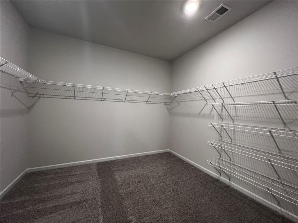 3339 Fall Branch Lane Buford, GA 30519 - Photo 22 of 30 a view of a room with racks on the wall
