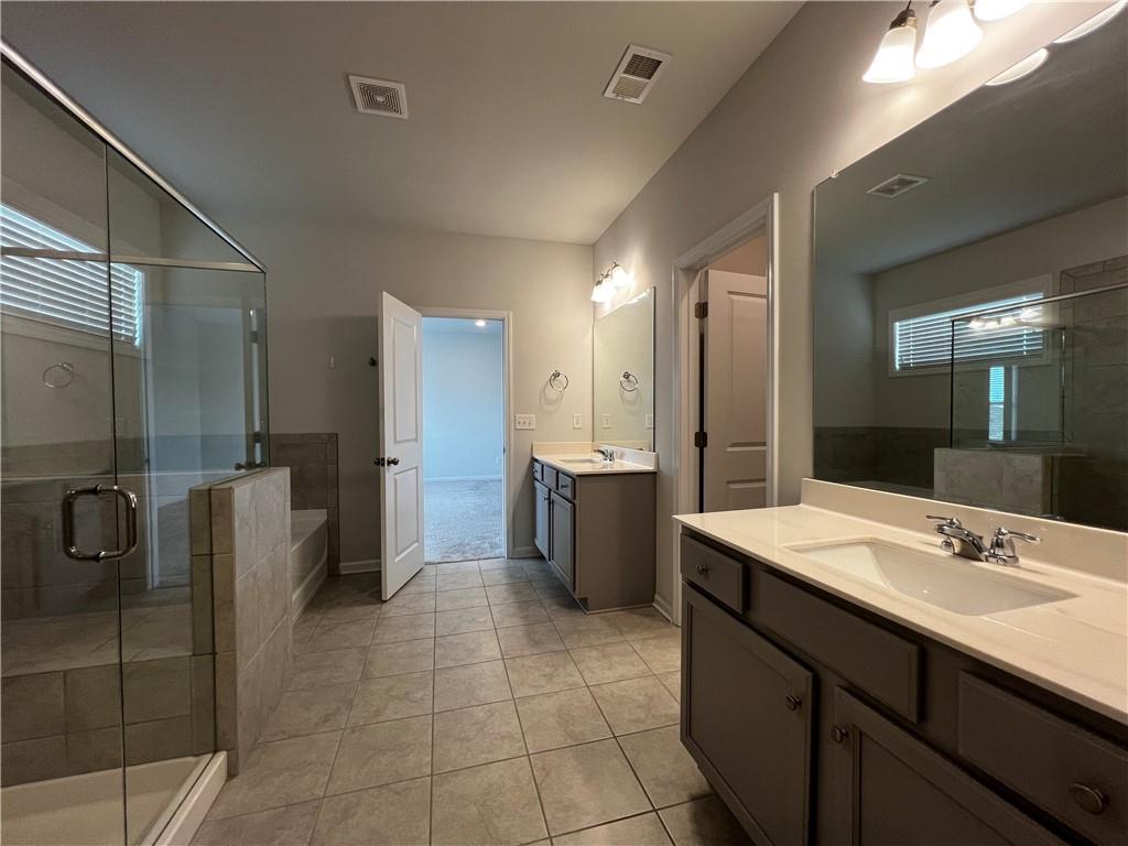 3339 Fall Branch Lane Buford, GA 30519 - Photo 23 of 30 a bathroom with a double vanity sink mirror and shower