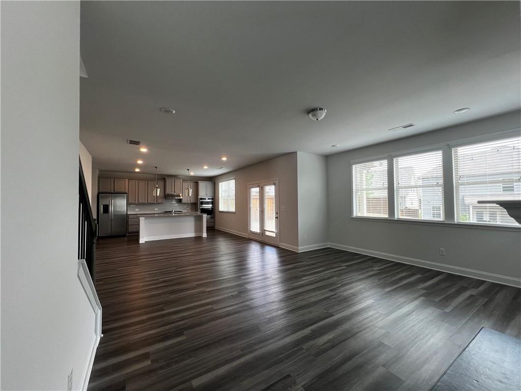 3339 Fall Branch Lane Buford, GA 30519 - Photo 5 of 30 a view of kitchen and dining room with wooden floor