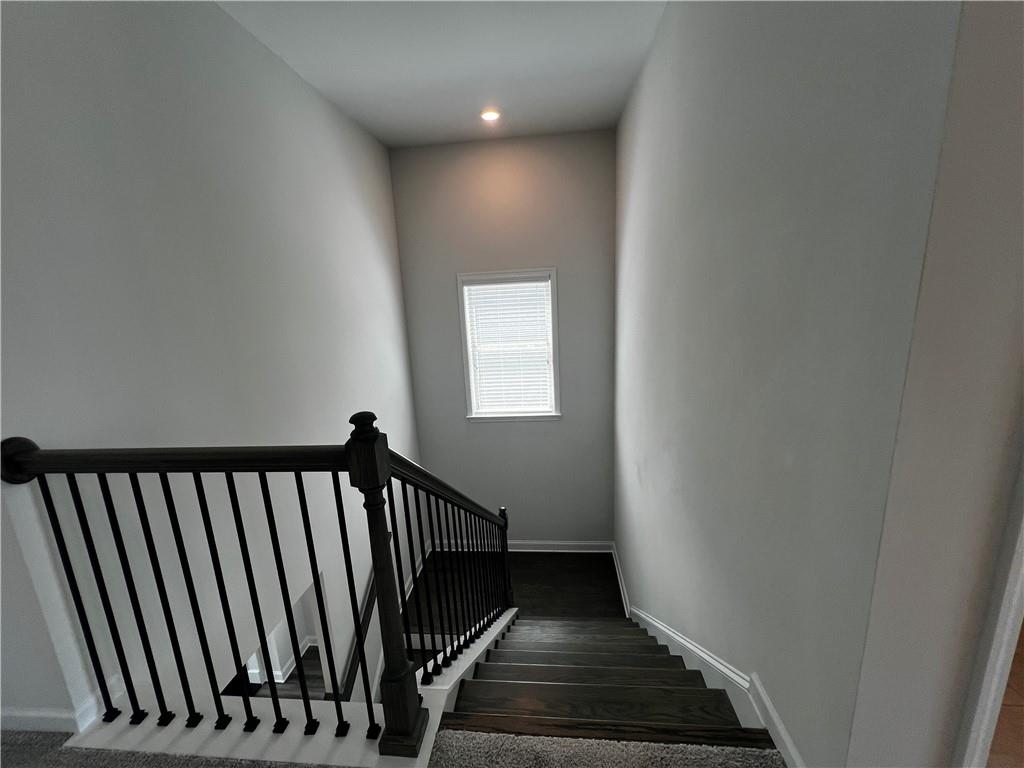 3339 Fall Branch Lane Buford, GA 30519 - Photo 9 of 30 a view of a hallway with wooden floor and stairs