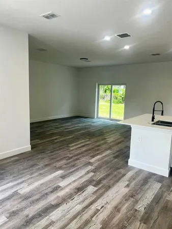 a view of a room that has a sink and a window