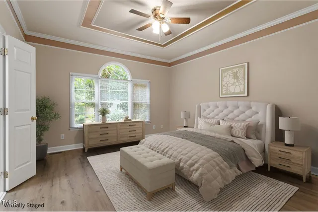 a bed room with a bed and a large window