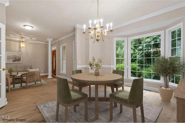 a view of a dining room with furniture window and outside view