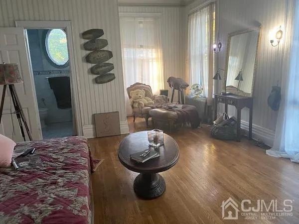 a bathroom with a toilet a sink and a mirror