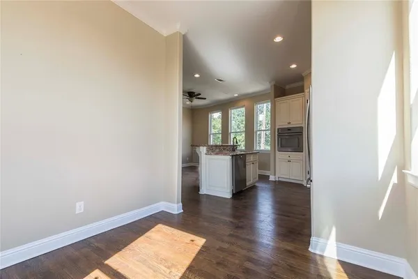 a view of a kitchen with a sink and a window
