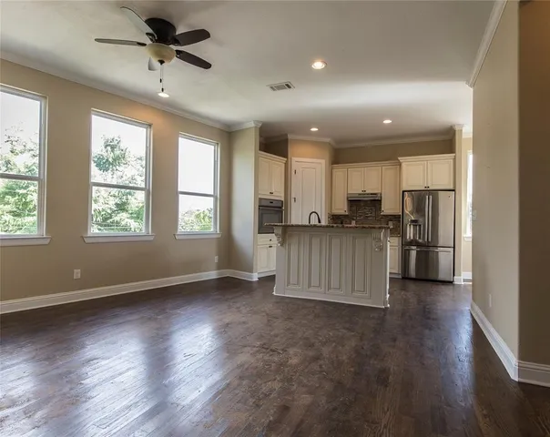 a view of a kitchen with a sink and a window