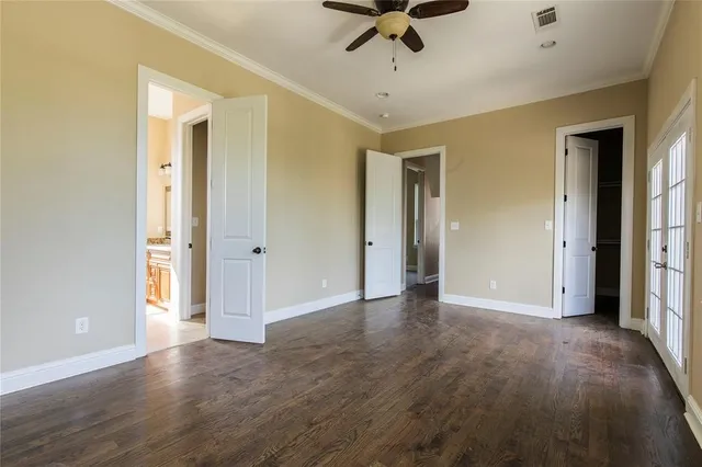 a view of a livingroom with a hardwood floor and a ceiling fan