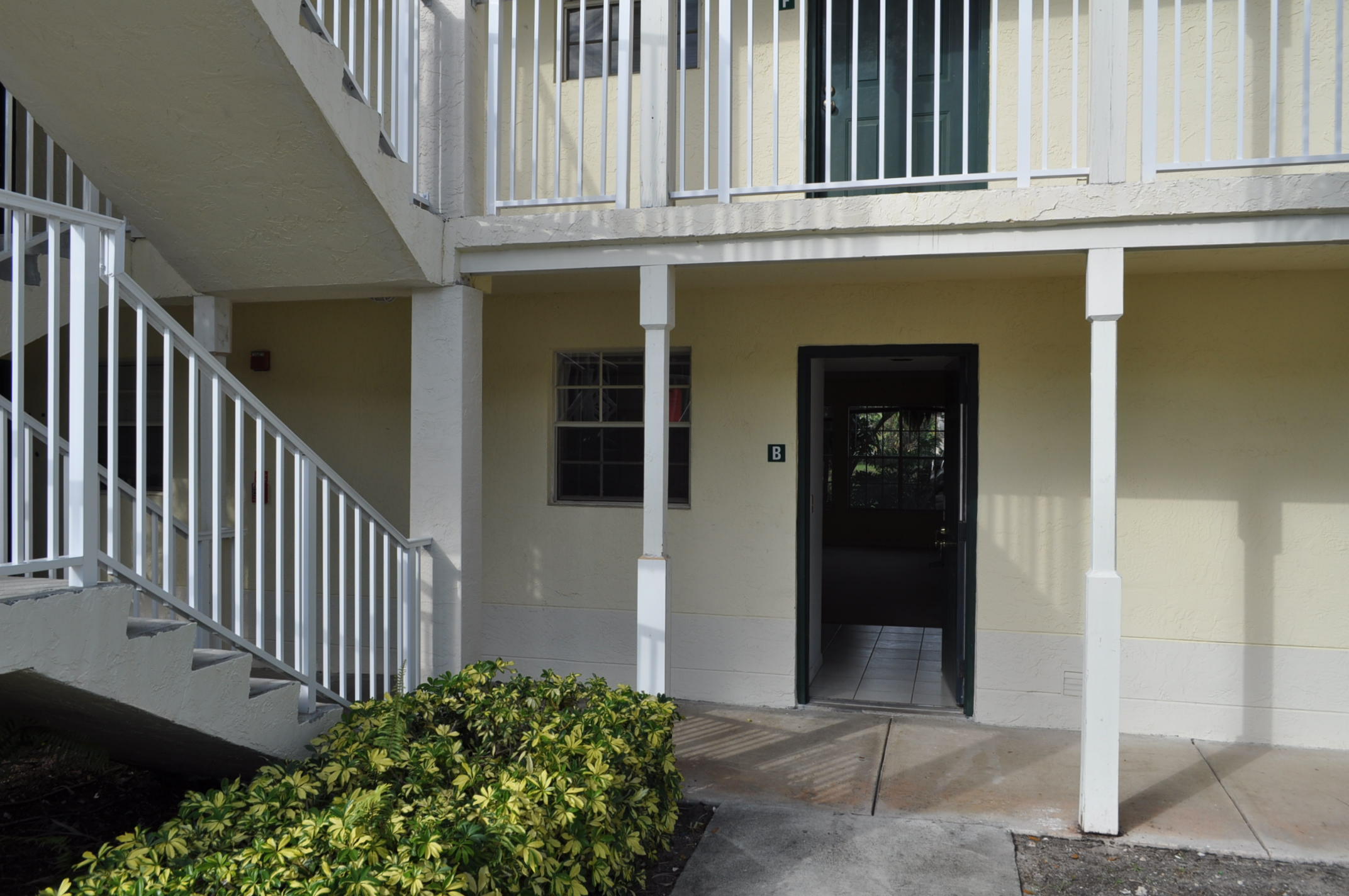 6284 La Costa Drive, Unit B Boca Raton, FL 33433 - Photo 1 of 8 a view of a house with wooden fence