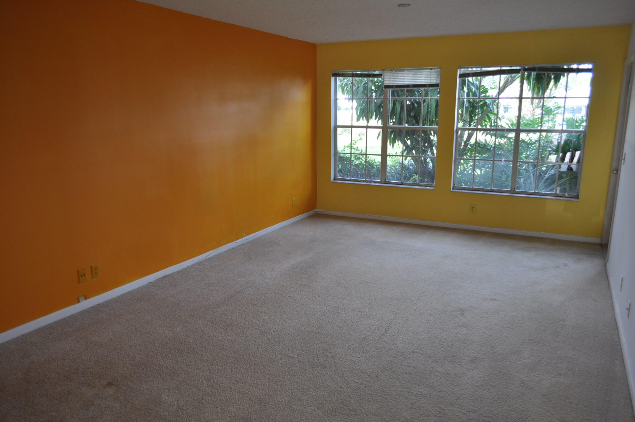 6284 La Costa Drive, Unit B Boca Raton, FL 33433 - Photo 4 of 8 an empty room with windows