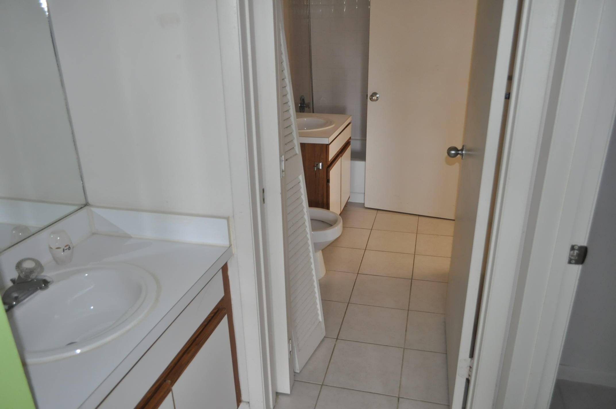 6284 La Costa Drive, Unit B Boca Raton, FL 33433 - Photo 7 of 8 a bathroom with a sink and washing machine