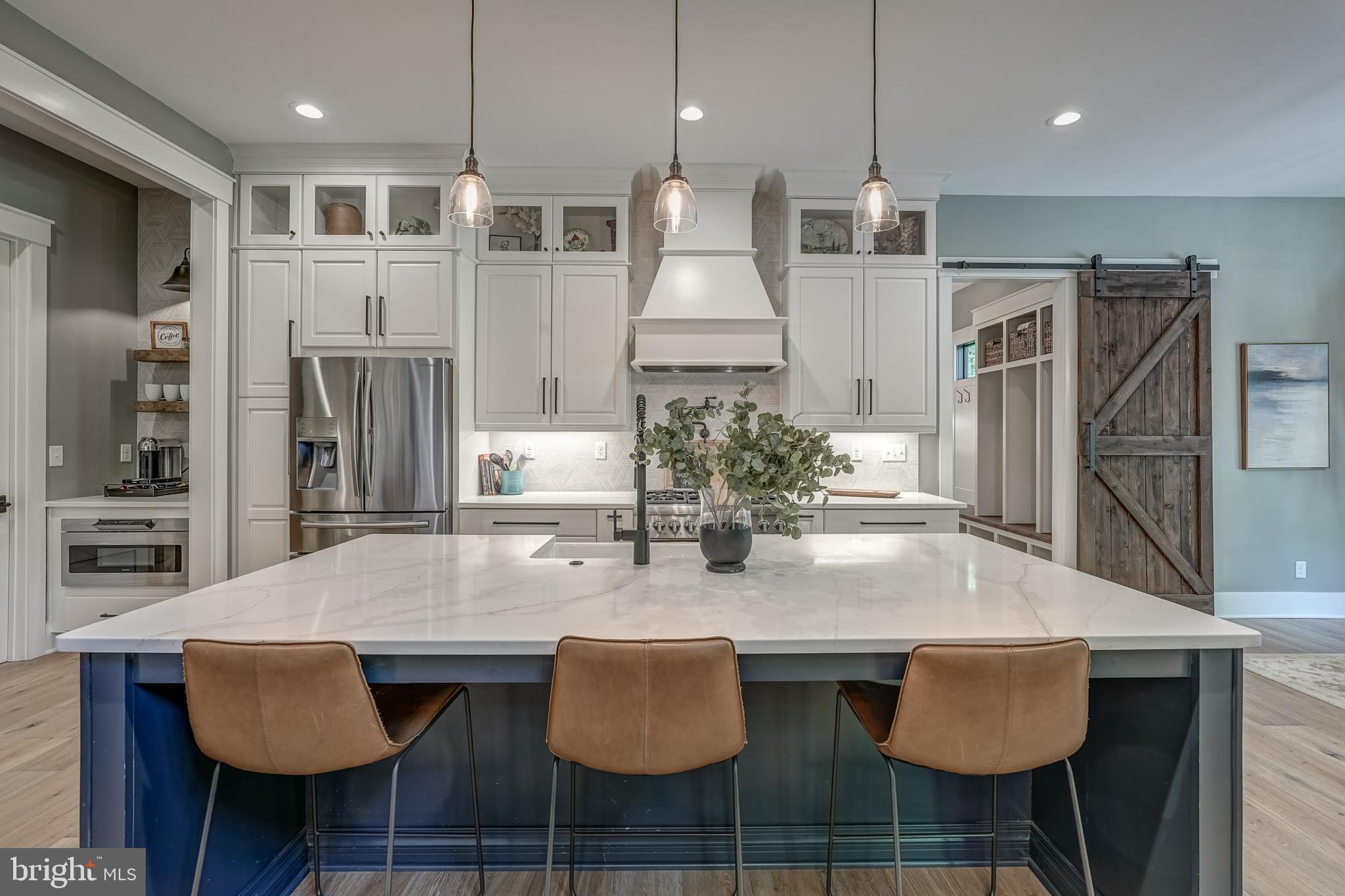 13325 Kelham Road Midlothian, VA 23113 - Photo 34 of 109 a kitchen with stainless steel appliances granite countertop a kitchen island a table and chairs in it