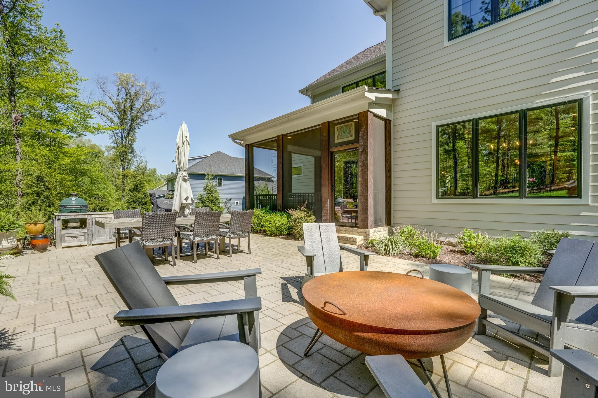 13325 Kelham Road Midlothian, VA 23113 - Photo 85 of 109 a view of a patio with table and chairs potted plants and floor to ceiling window