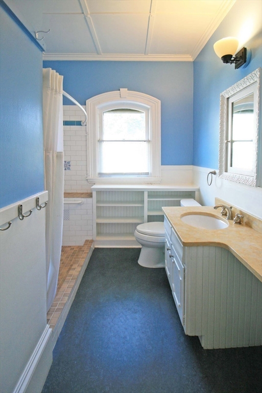 76 Crescent Street, Unit 2 Northampton, MA 01060 - Photo 14 of 25 a spacious bathroom with a tub sink and a vanity