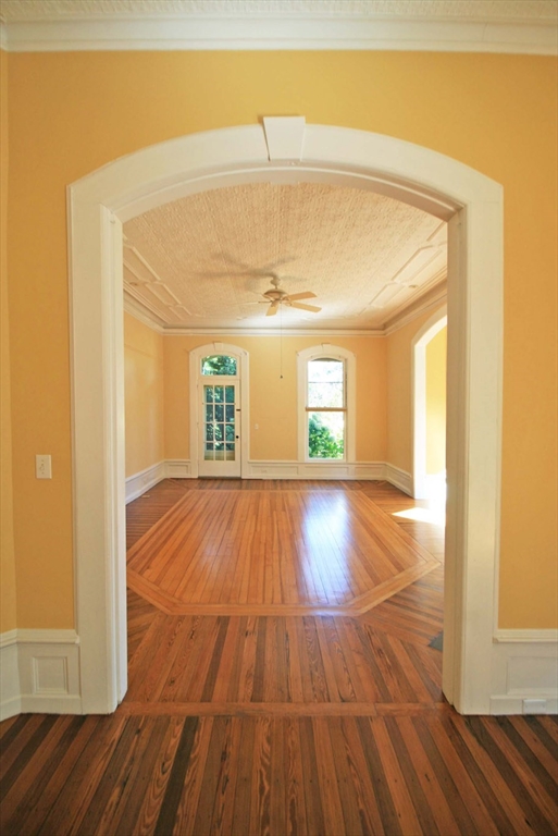 76 Crescent Street, Unit 2 Northampton, MA 01060 - Photo 3 of 25 a view of empty room with wooden floor and fan