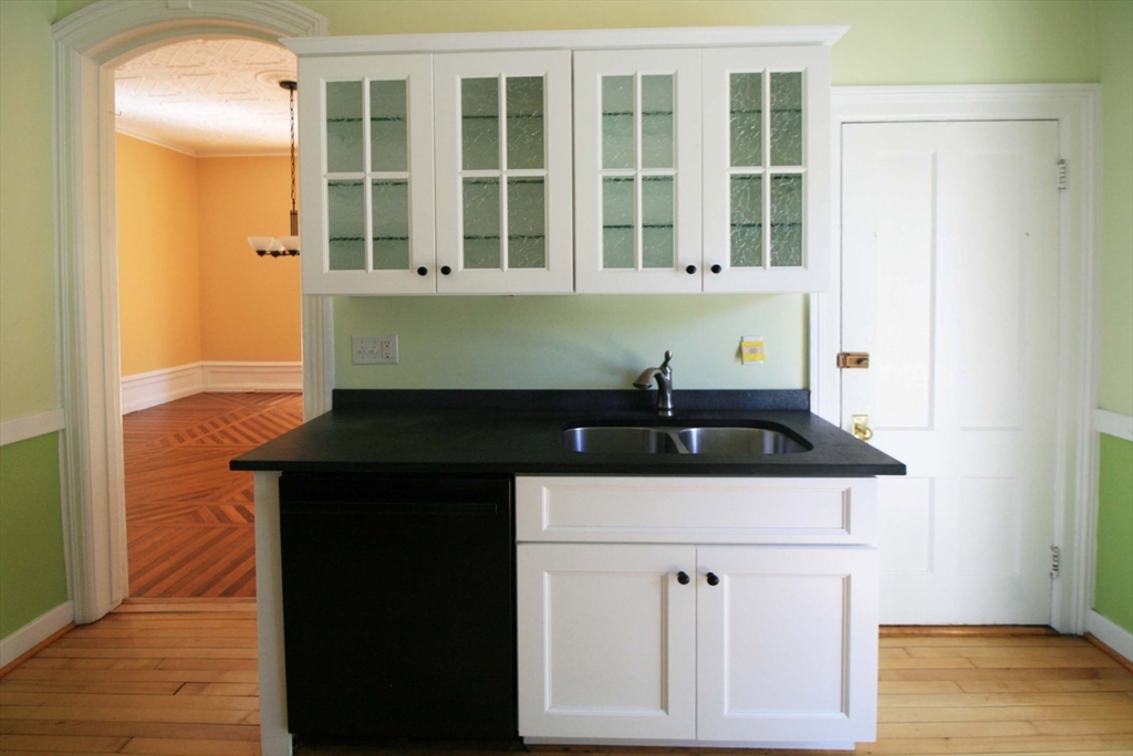 76 Crescent Street, Unit 2 Northampton, MA 01060 - Photo 7 of 25 a kitchen with a stove and a sink