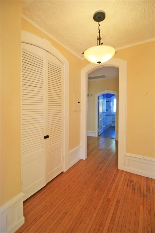 76 Crescent Street, Unit 2 Northampton, MA 01060 - Photo 8 of 25 a view of a room with wooden floor and a sink