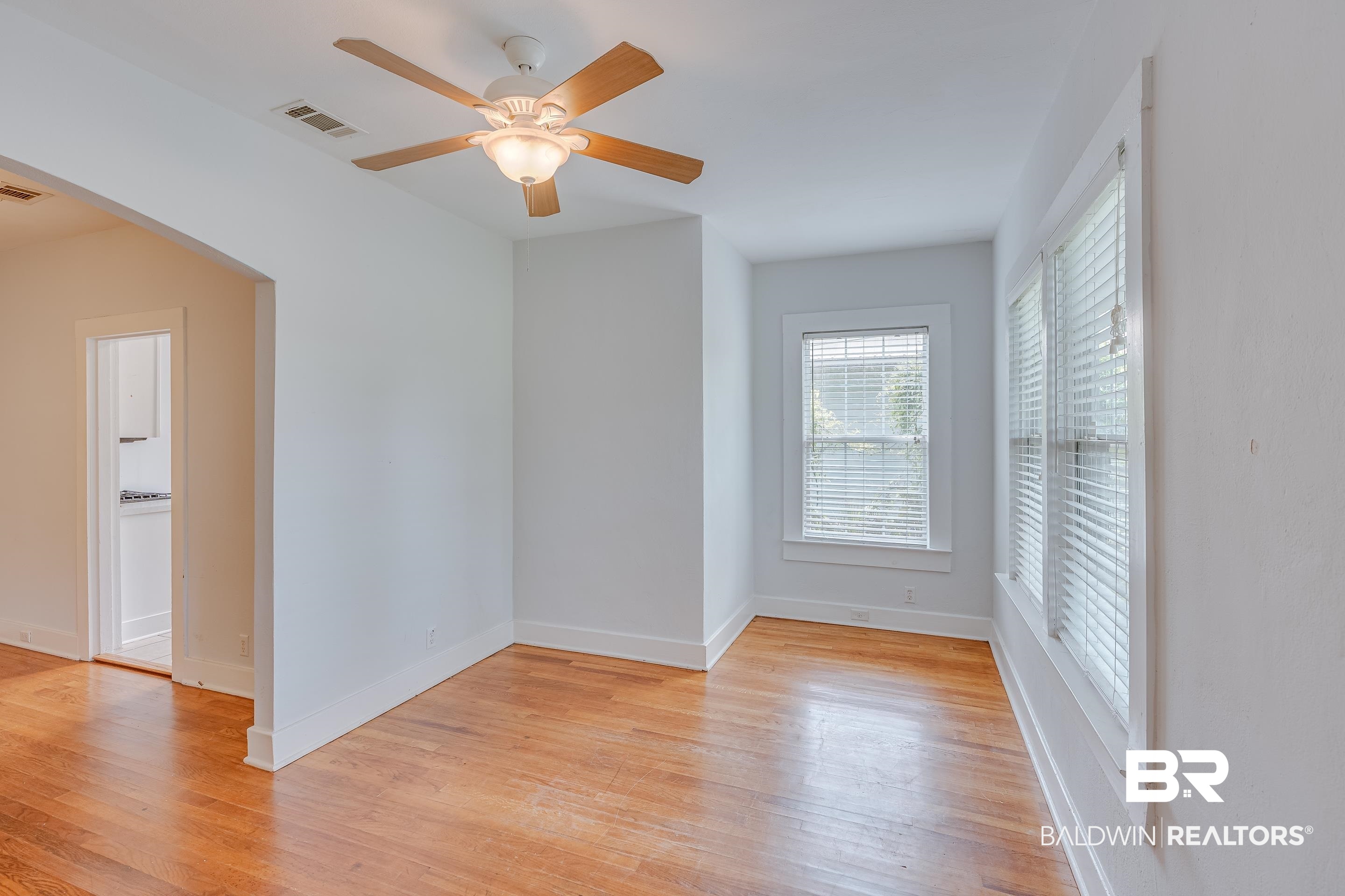 1852 Old Shell Road Mobile, AL 36607 - Photo 4 of 26 Spare room with light wood-style floors and a ceiling fan