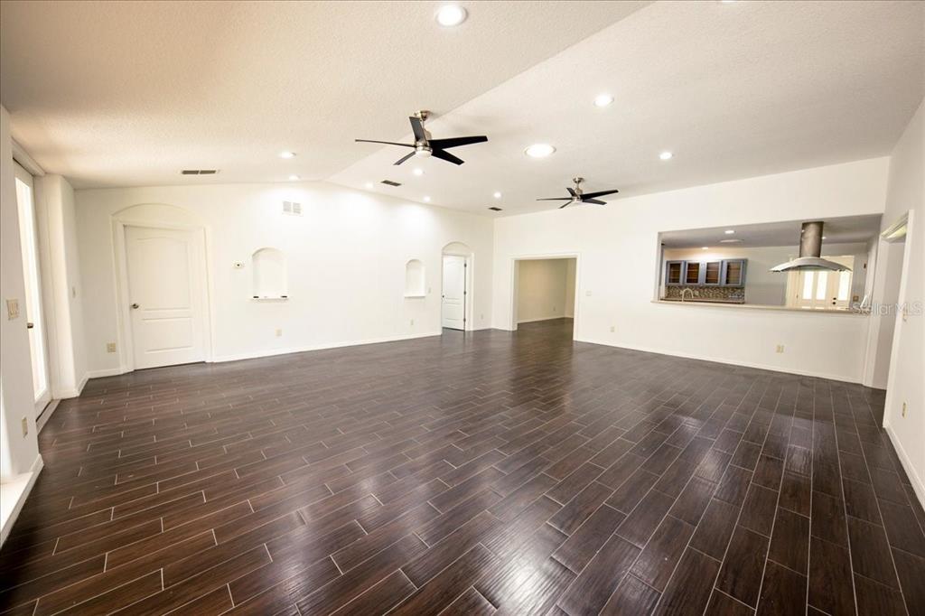 3443 Wild Myrtle Court Windermere, FL 34786 - Photo 11 of 32 wooden floor in an empty room with a window
