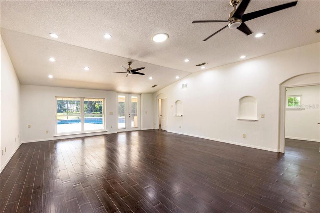 3443 Wild Myrtle Court Windermere, FL 34786 - Photo 12 of 32 an empty room with wooden floor and windows