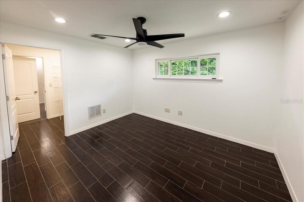 3443 Wild Myrtle Court Windermere, FL 34786 - Photo 13 of 32 a view of an empty room with wooden floor