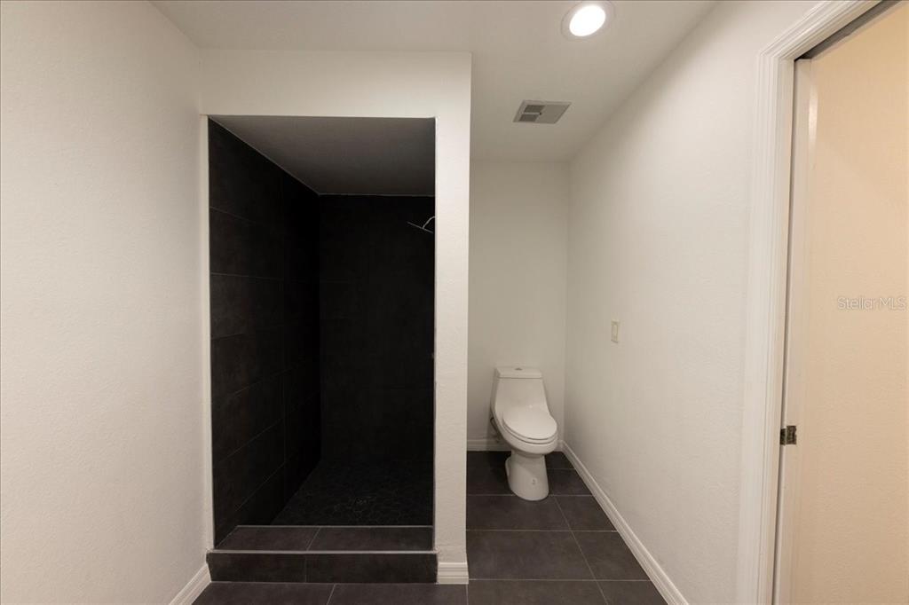 3443 Wild Myrtle Court Windermere, FL 34786 - Photo 23 of 32 a bathroom with a toilet and a vanity