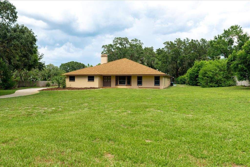 3443 Wild Myrtle Court Windermere, FL 34786 - Photo 29 of 32 a front view of a house with garden