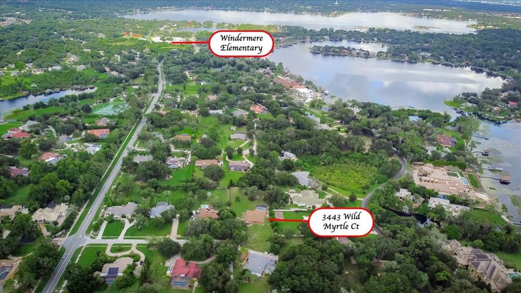 3443 Wild Myrtle Court Windermere, FL 34786 - Photo 31 of 32 a view of a street with a forest