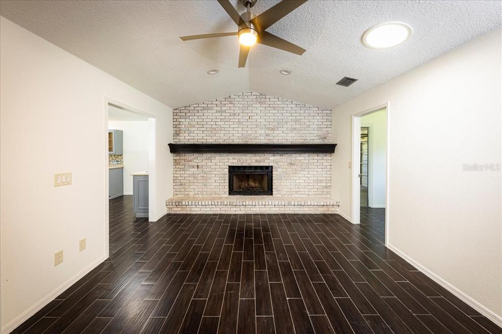 3443 Wild Myrtle Court Windermere, FL 34786 - Photo 7 of 32 a view of an empty room with wooden floor