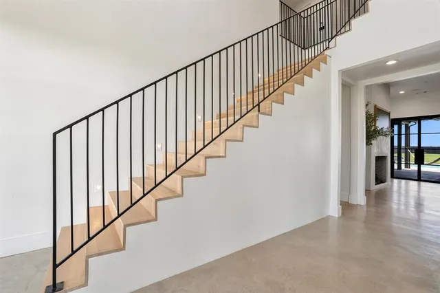 a view of staircase with wooden floor and stairs