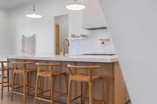 a kitchen with a sink cabinets and window