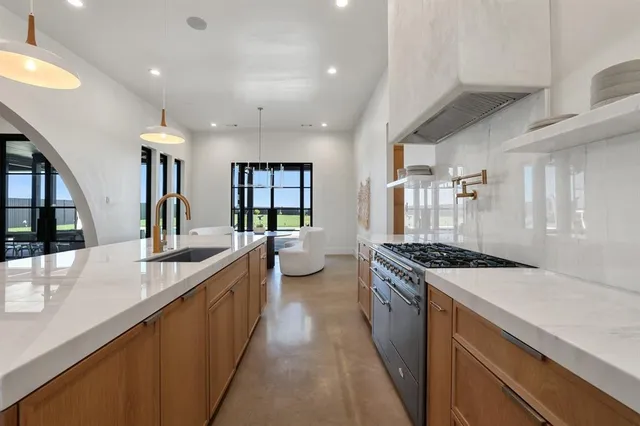 a kitchen with a stove and a sink