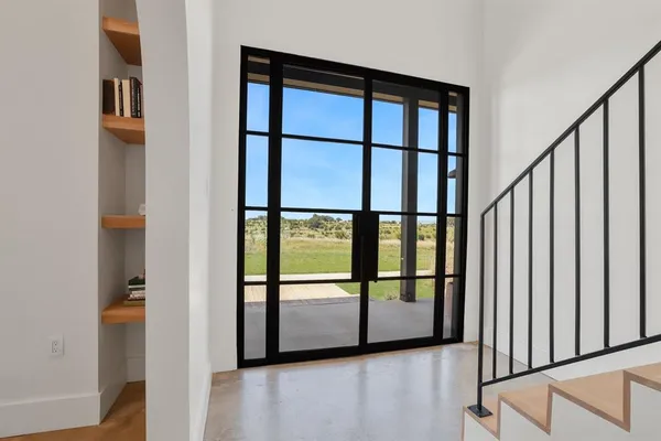 a kitchen with stainless steel appliances granite countertop a sink a stove a refrigerator and island