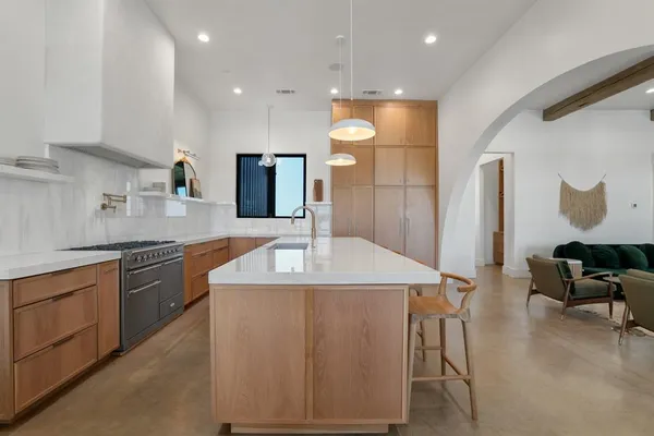 a kitchen with a table and chairs in it