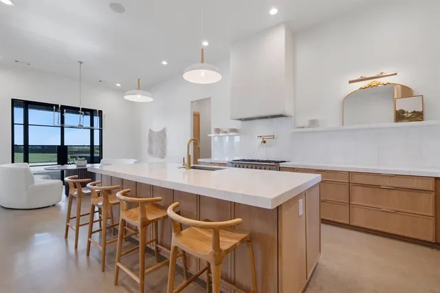 a kitchen with a table and chairs in it