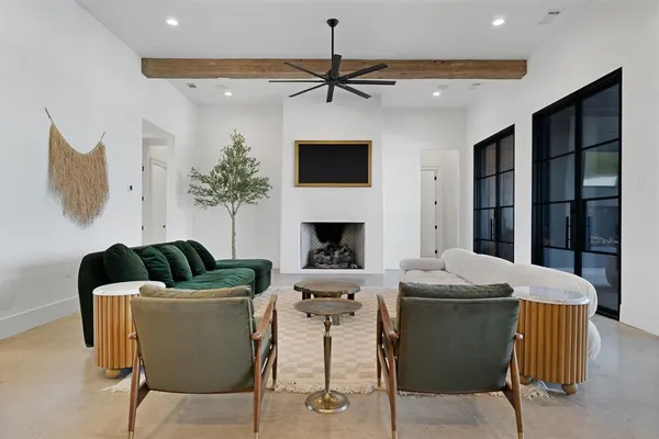 a dining room with furniture a window and a chandelier