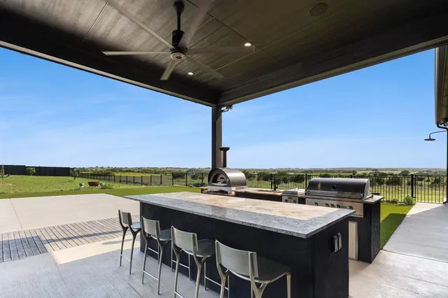 a view of a swimming pool and an outdoor seating