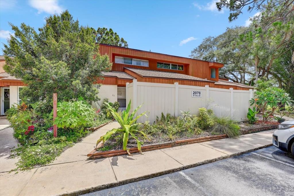 2078 Sunset Point Road, Unit 83 Clearwater, FL 33765 - Photo 1 of 1 front view of a house with a yard