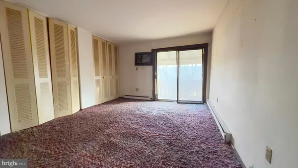a view of an empty room and window